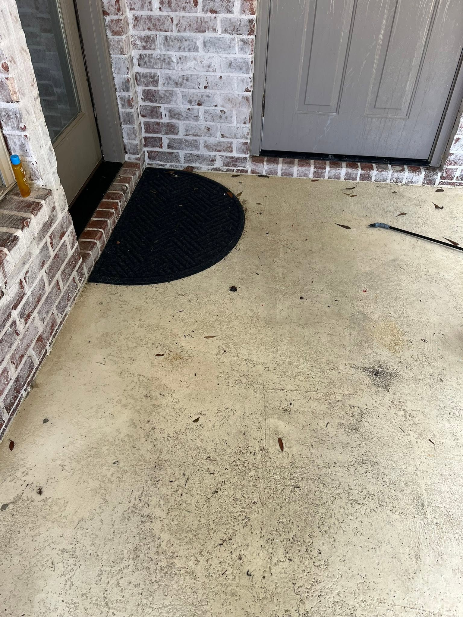 Dirty front porch before pressure washing